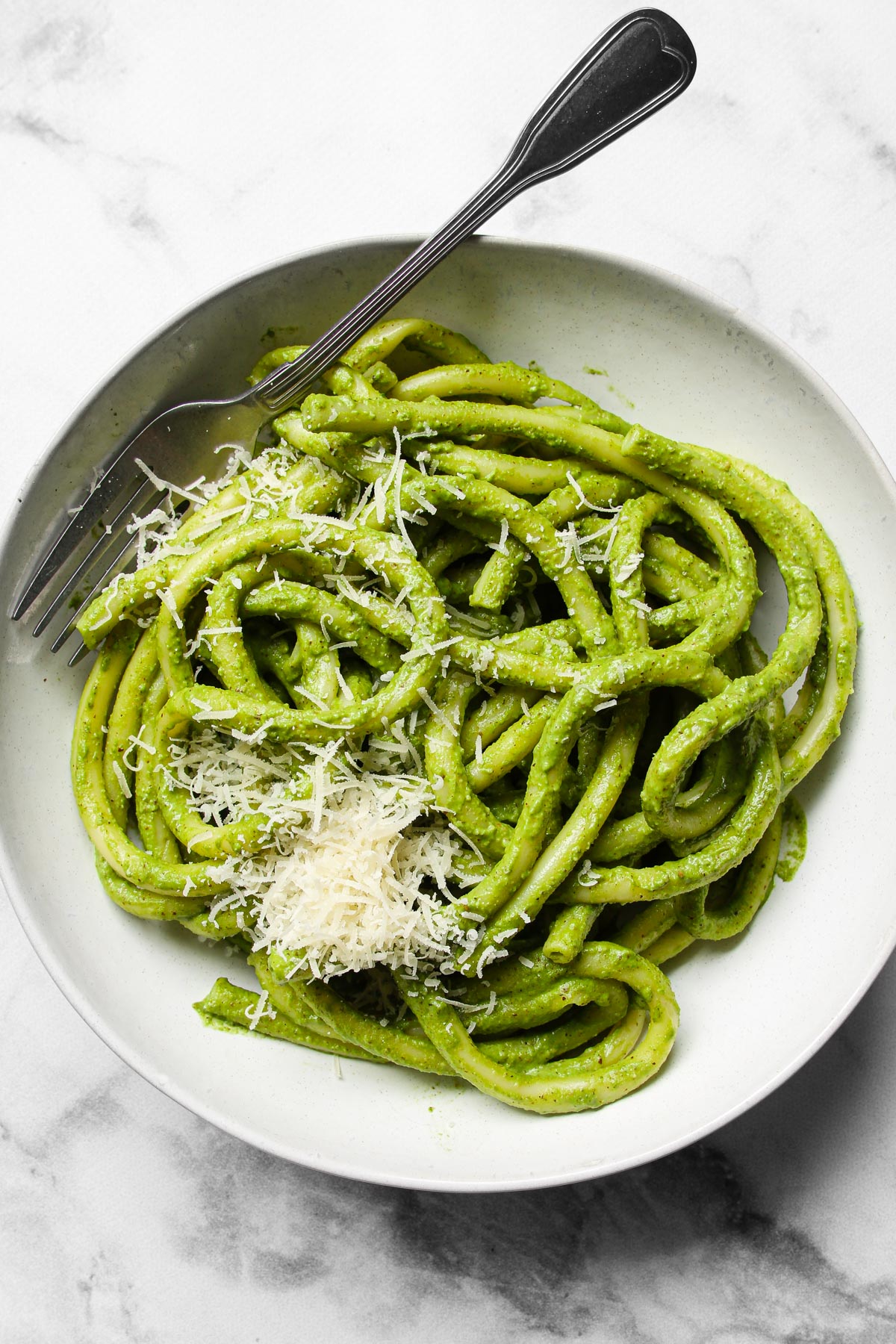 Green pesto pasta on plate