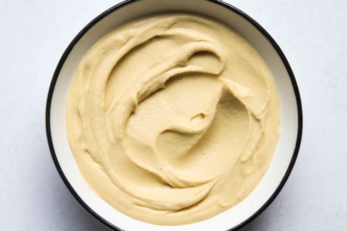 Smooth and creamy hummus in bowl