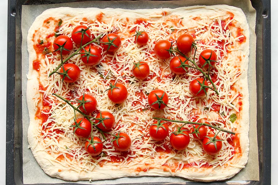 Tomato pizza before baking