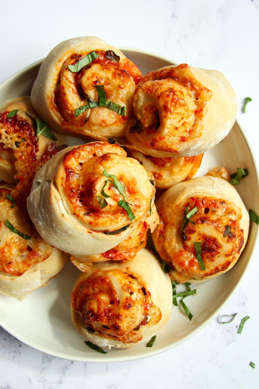 plate with pizza rolls