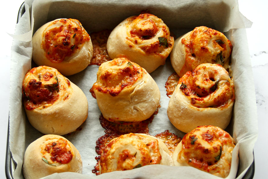 Baked pizza rolls in pan