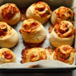 Baked pizza rolls in pan