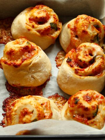 Baked pizza rolls in pan