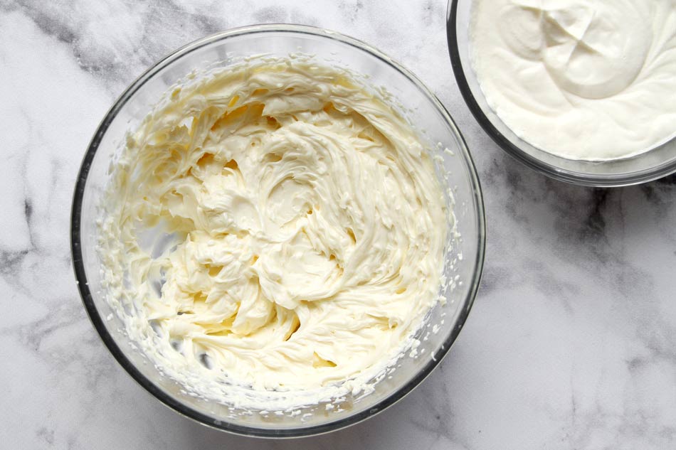 Cream cheese filling and whipped cream in bowls